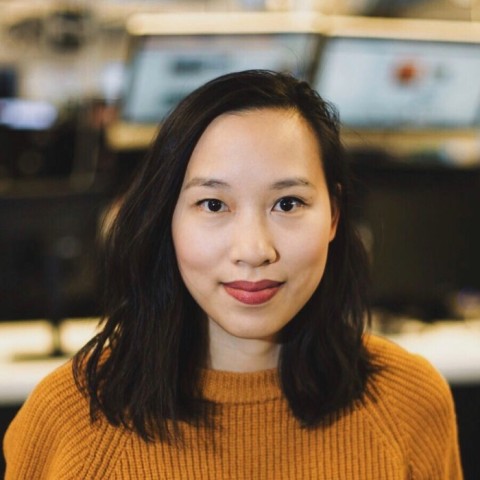Vanessa Vu with long black hair smiling lightly into the camera