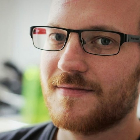 Lorenz Grünewald-Schukalla close-up with glasses and beard