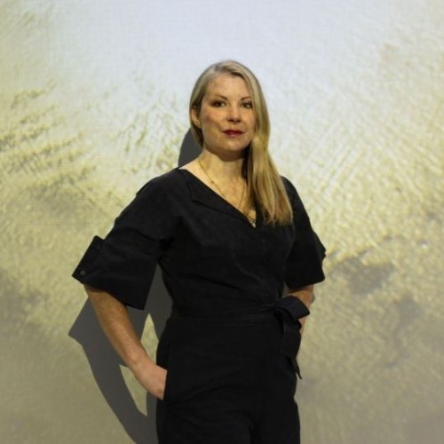 Libby Heaney photographed infront of her Exhibition "Ent-"