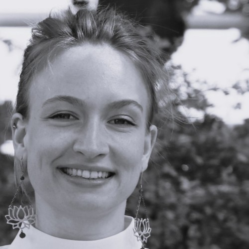 Black and white photo of a person smiling