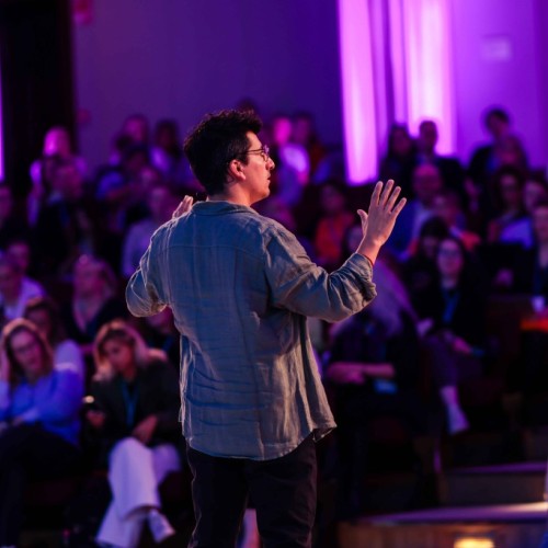 Dr. Joaquín Santuber giving a talk in front of an audience at the Legal Design Summit 2023, Helsinki.