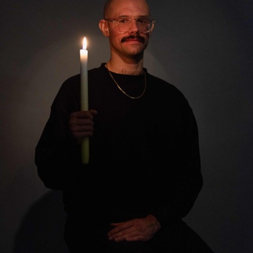 Guy holding candle