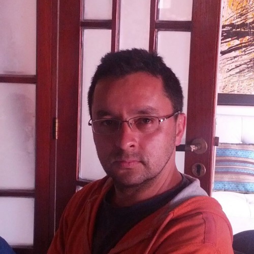 Picture of Offray Luna, showing him with small glasses on